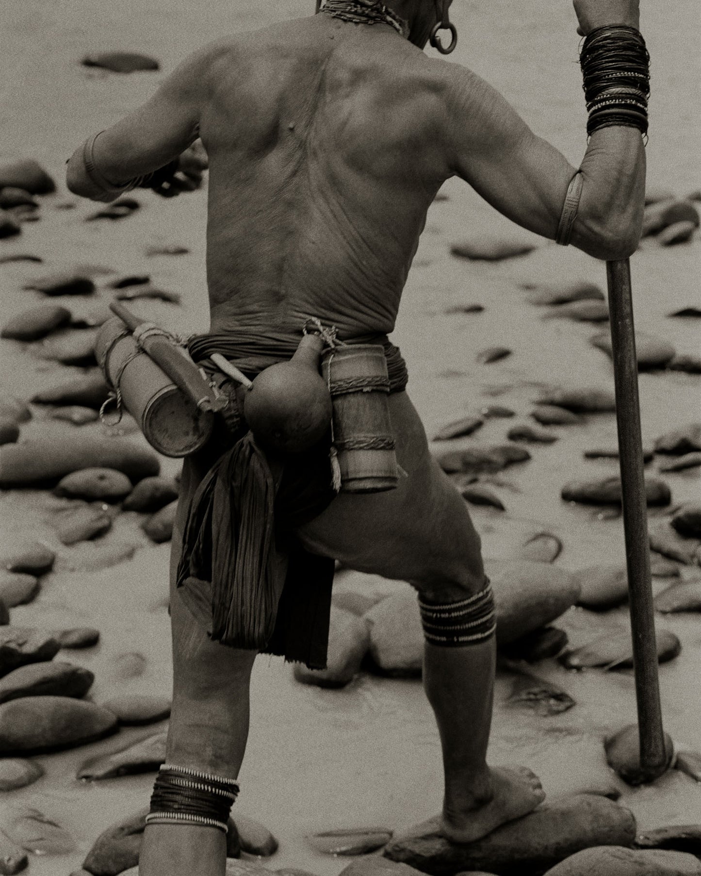 Penan Hunter Walking in River, Borneo